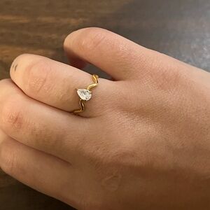 Gold plated stainless steel wave ring with pear stone